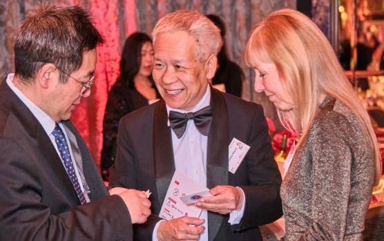 Guests laughing together at the dinner
